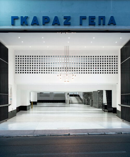 parking garage's black marble reception in central athens features brass details