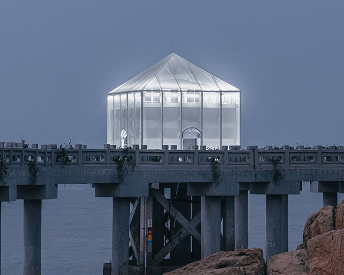 covered in sheer white mesh, this daydream trail station casts a poetic glow in coastal china